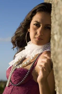 Red bustier by rocks Stock Photos