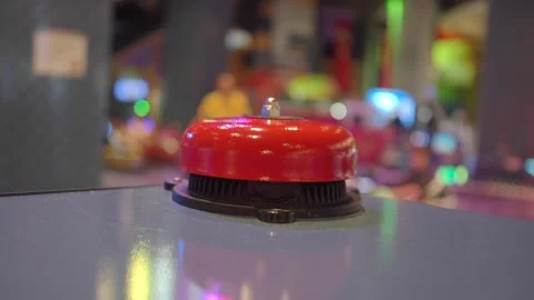 Red button on arcade machine in a game center during the night Stock Footage 345953204