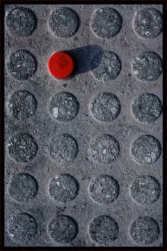 Red button on asphalt Stock Photos