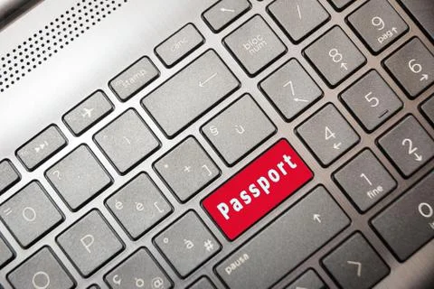 Red button on the computer with the text Passport Stock Photos