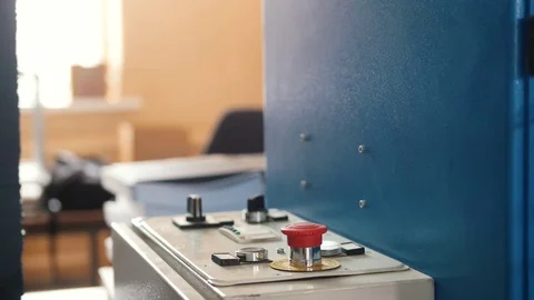 Red button on folding machine - printing polygraph industry, close up Stock Footage 76963178