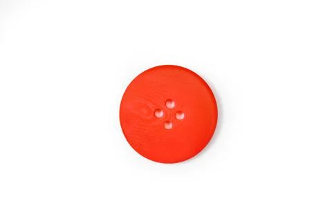 A red button isolated on a white background in a close up view Foto stock