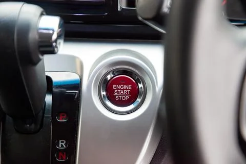 Red Button start and turn off the ignition of the car engine close-up on the  스톡 사진