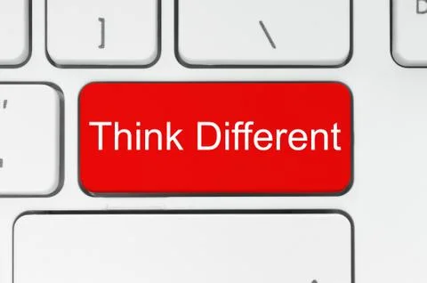 Red button with think different words on the keyboard Stock Photos