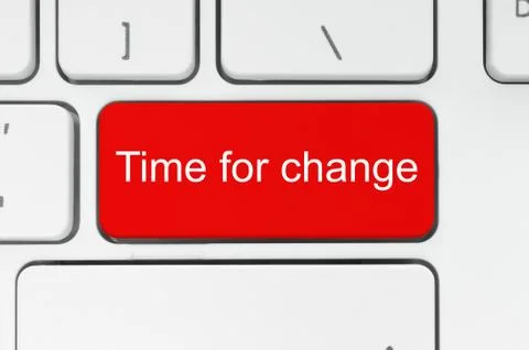 Red button with time to change words on the keyboard Stock Photos
