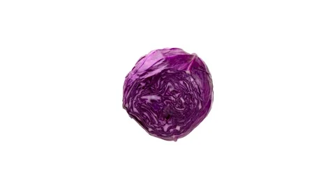 Red cabbage being cut on white background. Stop motion Stock Footage 132481816