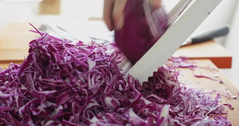 Red cabbage chopped using mandoline slicer Stock Footage 146712532