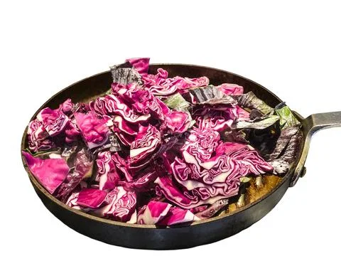 Red cabbage closeup in a pan being sauteed Stock Photos