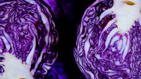 Red cabbage in a cut on a purple crumpled bright background. farm vegetables. Stock Footage 153453901