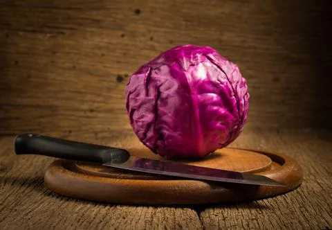 Red cabbage with kitchen knife on chopping board wood. on kitchen woodden Stock Photos