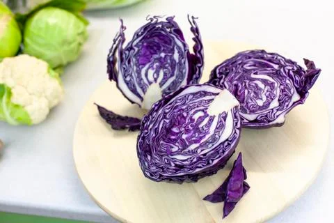 Red cabbage on the kitchen table, farm vegetables on a light background Stock Photos