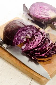 Red cabbage prepared and sliced on a wooden board Stock Photos