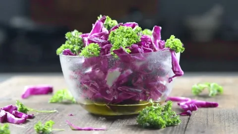Red cabbage salad in the kitchen Stock Footage 248772697