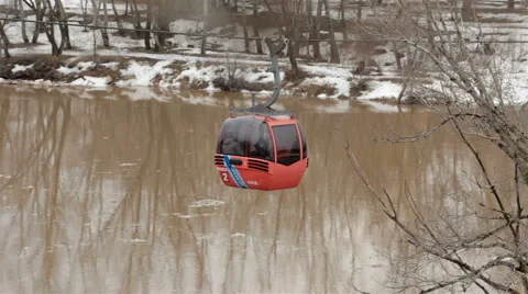 Red cabin cableway under river Stock Footage 65116332