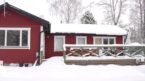 Red cabin covered in snow. Winter scene. Stock Footage 285844899