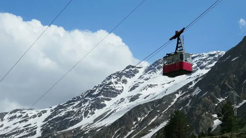 Red cable car in the background of the mountains Old red cable car at mountain. Stock Footage 123452270