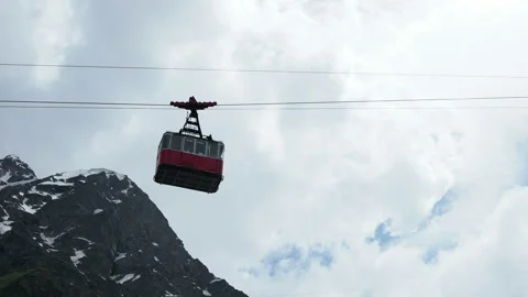 Red cable car in the background of the mountains Old red cable car Stock Footage 130888756