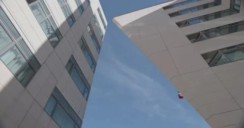 Red cable car cabin above the hotel in the resort Stock Footage 163963997