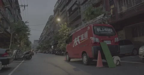 Red Cable Television Service Van On The Side Of An Old Urban Street(Graded) Stock Footage 226375293