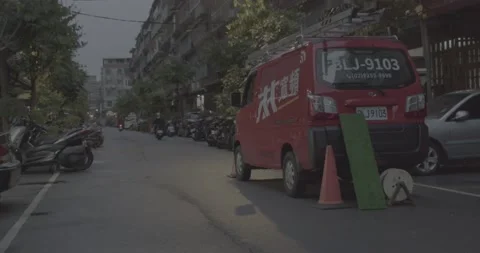 Red Cable Television Service Van On The Side Of An Old Urban Street(Ungraded) Stock Footage 226375304