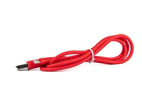 Red cable with USB and mini-USB connectors on a white background. Stock Photos