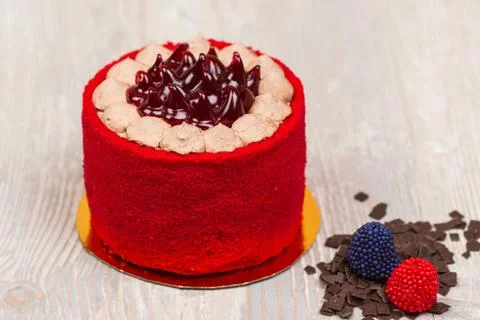 The red cake and chocolate on the table Stock Photos