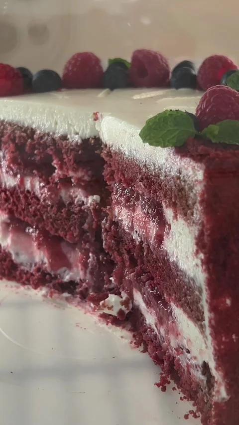 Red cake with cream and raspberry flavor, a piece of sweet dessert red cake with Stock Footage 312014854