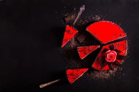 Red Cake with rose on black background. Top view. Valentine's Day. Free space Stock Photos
