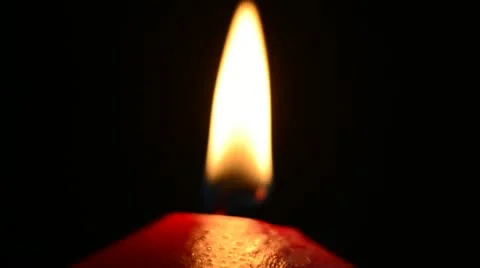 Red candle on a black background Stock Footage 21725790