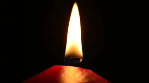 Red candle on a black background Stock Footage 21725993