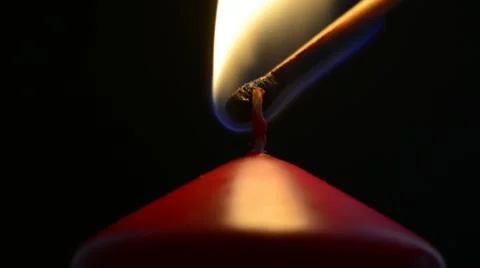 Red candle on a black background Stock Footage 21727322