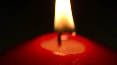 Red candle on a black background Stock Footage 21730961