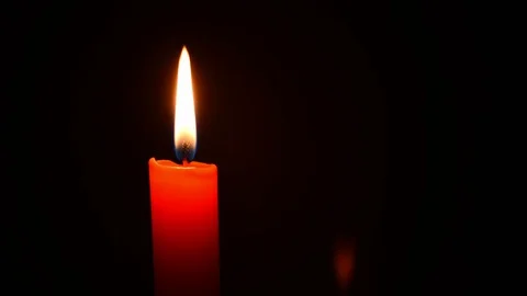 Red candle with black background time-lapse Stock Footage 127717170