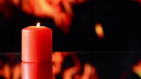 Red candle burning on black background Video stock 167069487