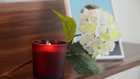 Red candle burning in the front the image of the deceased. Stock Footage 70198461