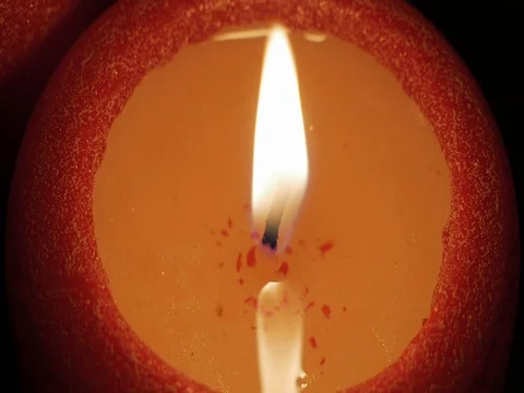The red candle burns. Close-up, top view. Видео 84852917