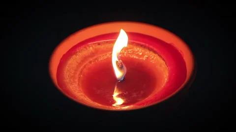 Red candle in clay container with thick wick Stock Footage 52516865