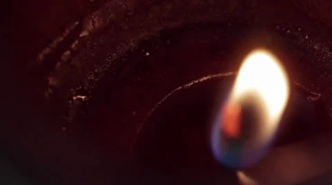 Red candle with closeup on flame Stock Footage 8324542