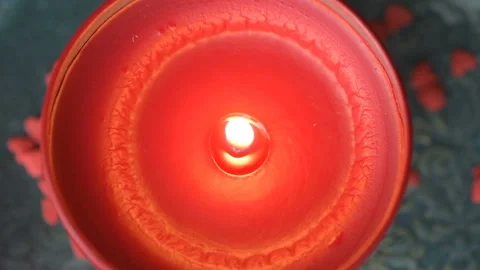 Red candle fire put out on green background Video stock 146805135