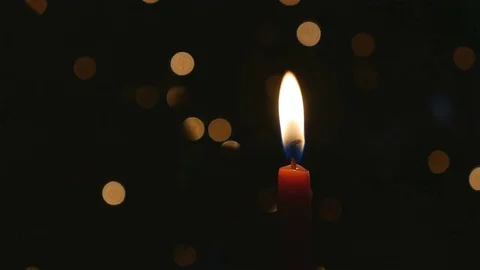 Red candle flame dark background blinking bokeh lights Stock Footage 71228978