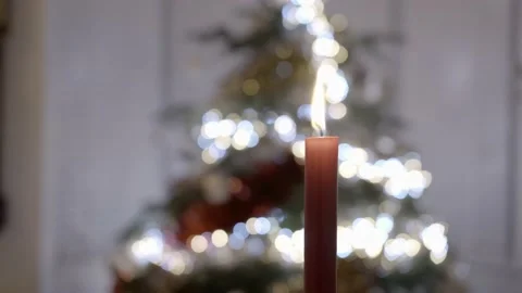 Red candle in front of a Christmas tree. Parallax slider shot. Stock Footage 144555010