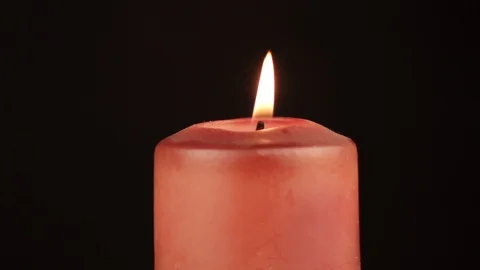 Red candle rotates 360 degrees on black background Stock Footage 119492256
