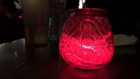 Red Candle on Table at Bar Stock Footage 98341760