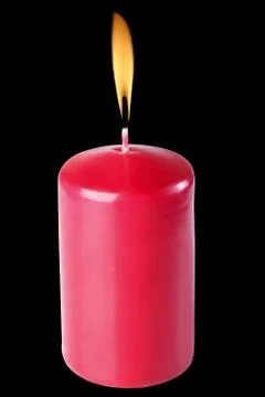 Red candles, burning, isolate on a black background, flames. Stock Photos