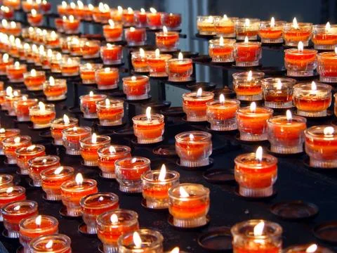 Red candles in a curch Stock Photos