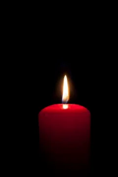 Red candles lighting in the darkness Stock Photos