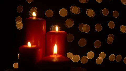 Red candles lights on bokeh background Stock Footage 82682126