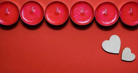 Red candles on a red background Stock Photos