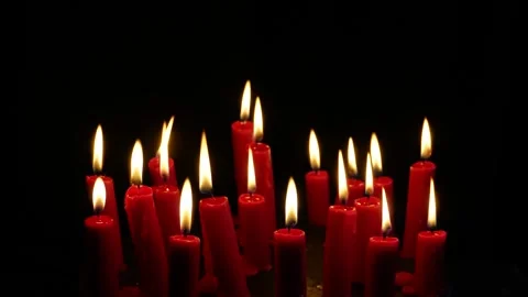 Red candles rotating and burn on a black background. C0219 Stock Footage 255204559