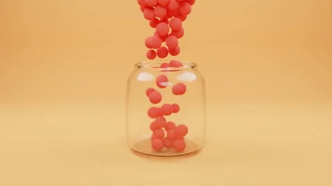 Red candy balls falling in jar Stock Footage 132767721